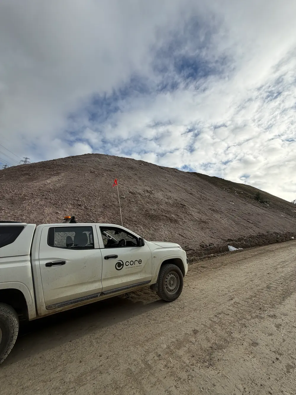 Core Environmental Projects vehicle parked beside a landfill batter finished with Posi-Shell